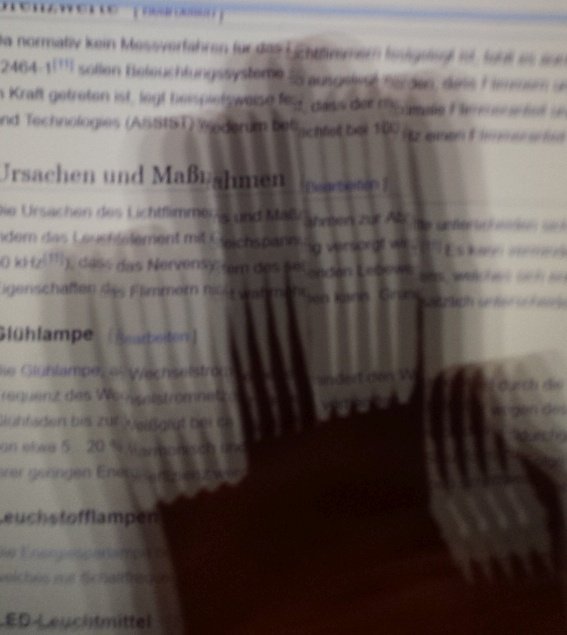 A moving hand reveals flicker from an LED backlight.