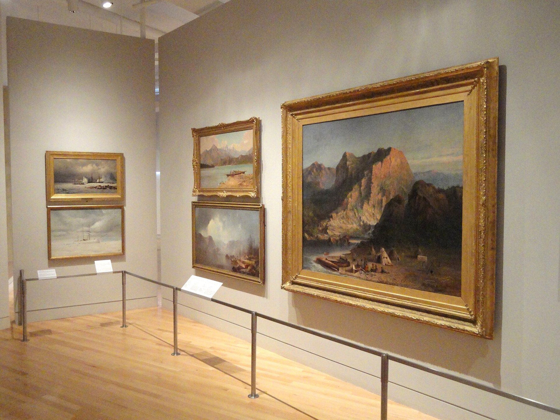 Paintings displayed on a wall at the Royal Ontario Museum.