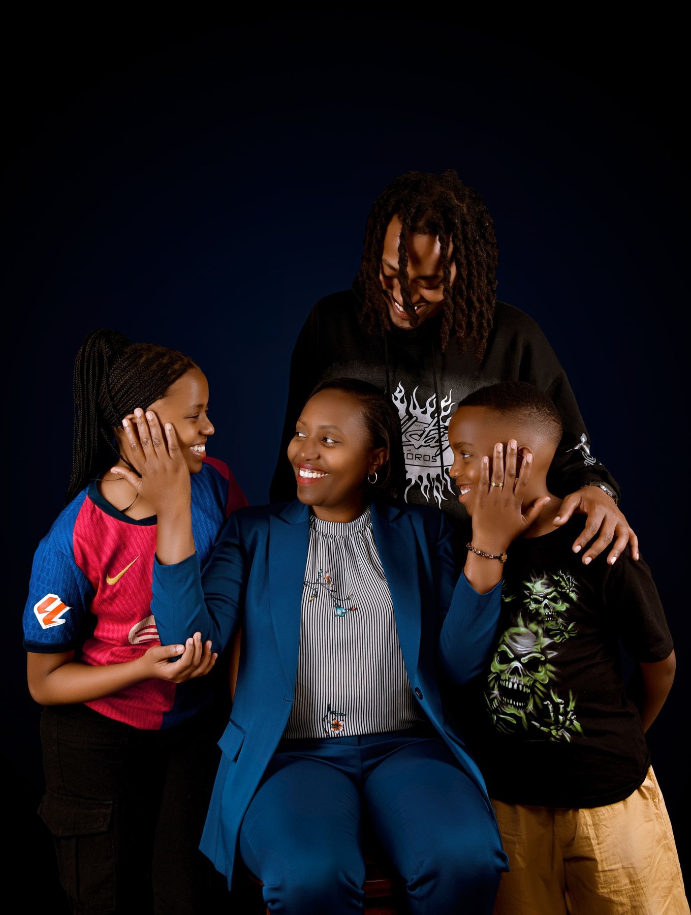 A family arranged as a compact group for a portrait.