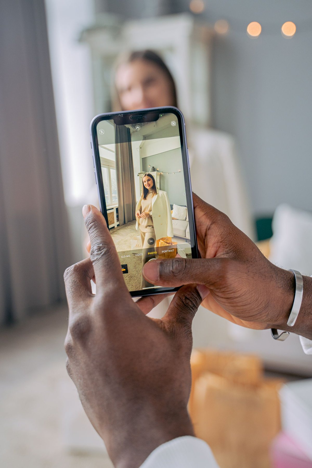 A smartphone camera view while photographing a portrait.