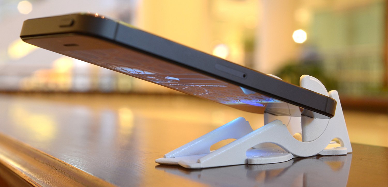 A compact stand supporting a smartphone.