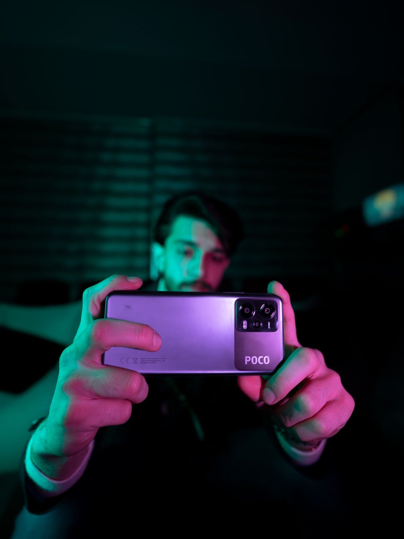 A smartphone used for photography in low indoor light.