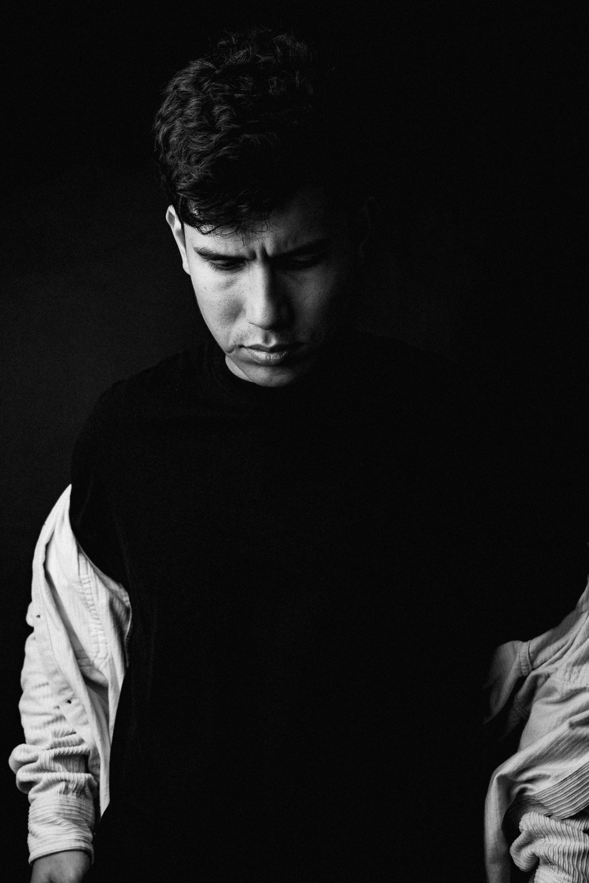 Black-and-white portrait with graduated tones.