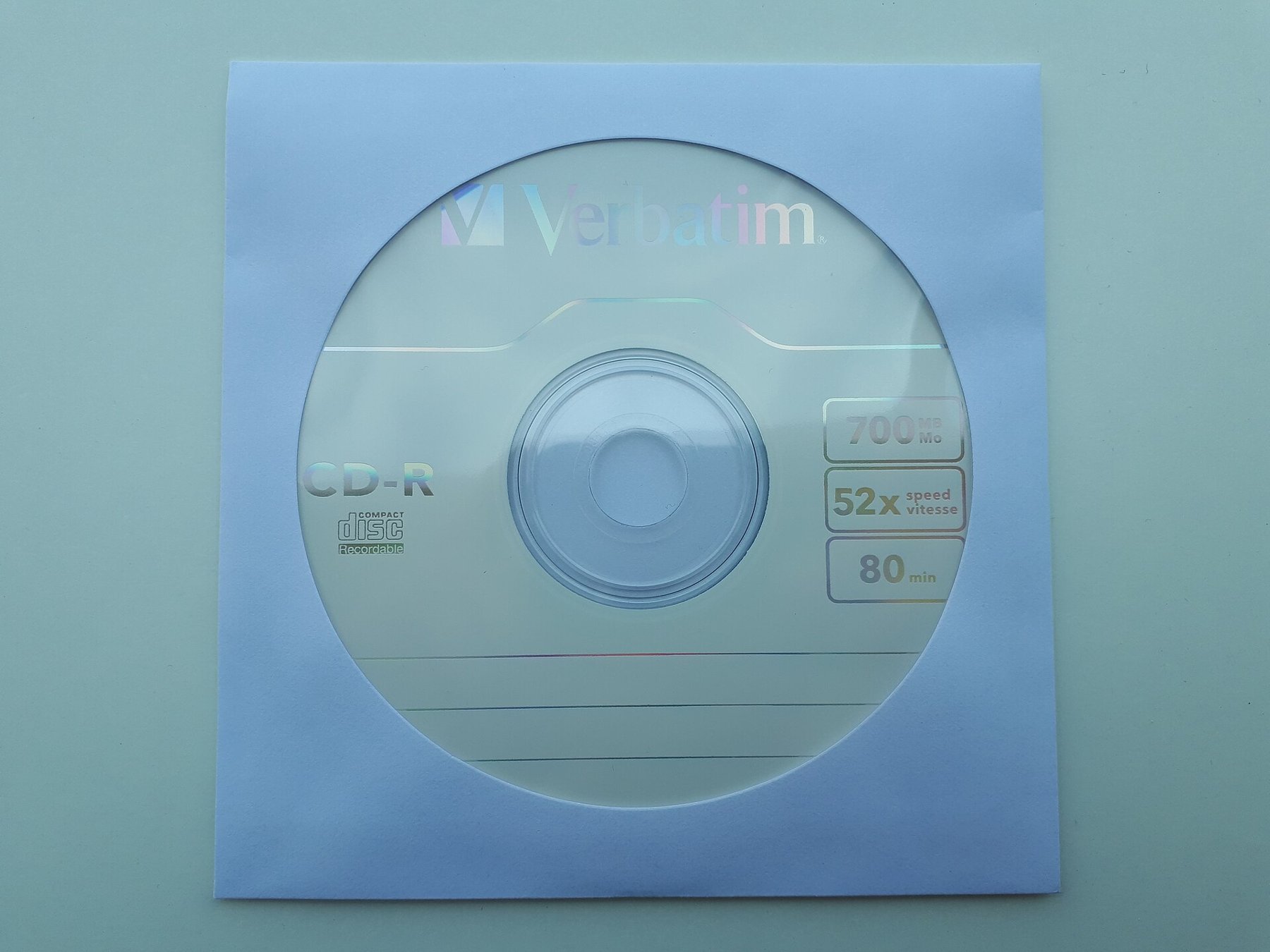 A paper sleeve with a visible blue colour cast.